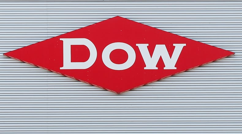 FILE - The Dow corporate logo in Midland, Mich., Aug. 2, 2019. (AP Photo/Paul Sancya, File)