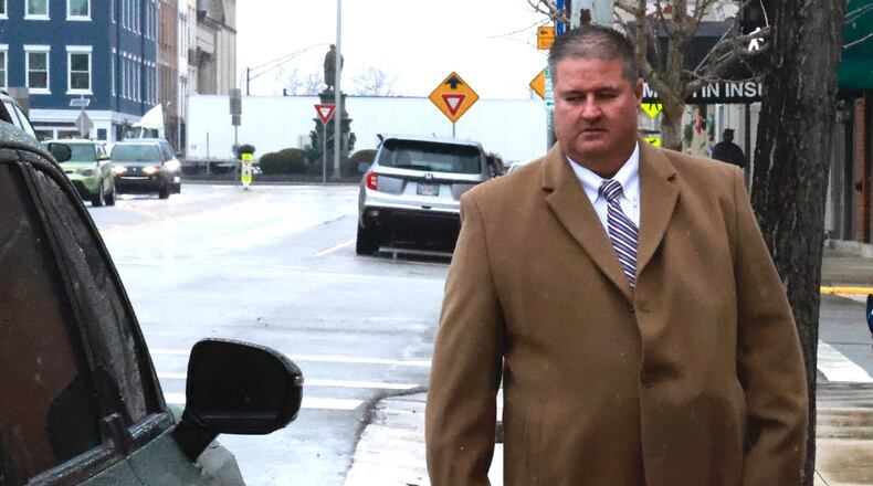 Champaign County Sheriff Matt Melvin leaves municipal court in Urbana after being arraigned Friday, Dec. 20, 2024. BILL LACKEY/STAFF