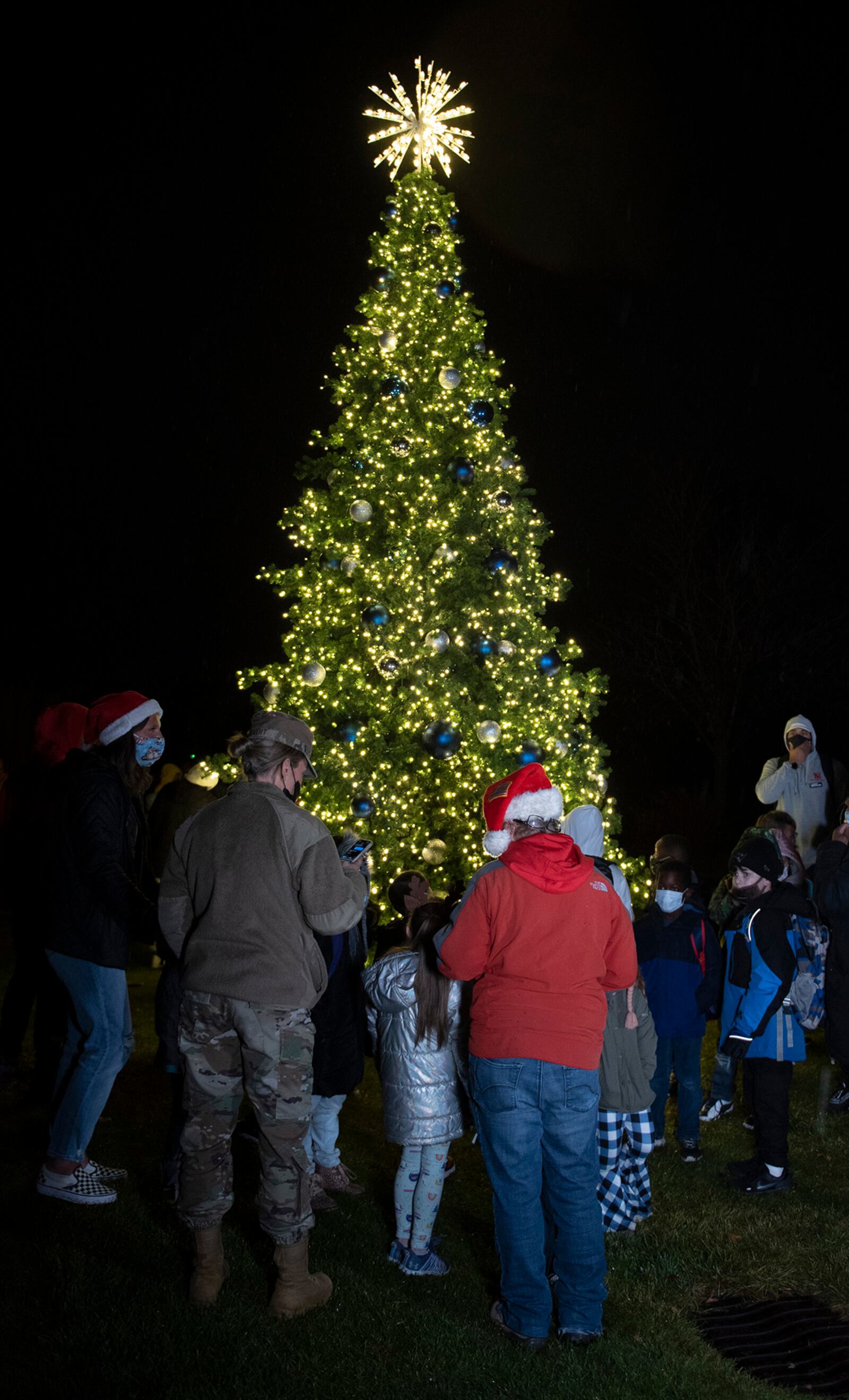 The newly lit Wright-Patterson Air Force Base Christmas tree sits on display outside the Wright-Patterson Club near Prairie Trace Golf Course during the 2021 tree lighting drive-thru event Dec. 1 hosted by the 88th Force Support Squadron. U.S. AIR FORCE PHOTO/JAIMA FOGG
