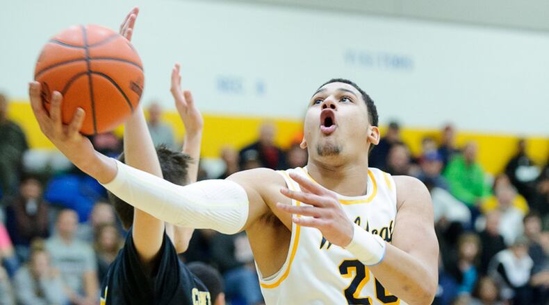 Springfield junior forward Leonard Taylor shoots during a Greater Western Ohio Conference game against Centerville on Friday night. Contributed Photo by Bryant Billing