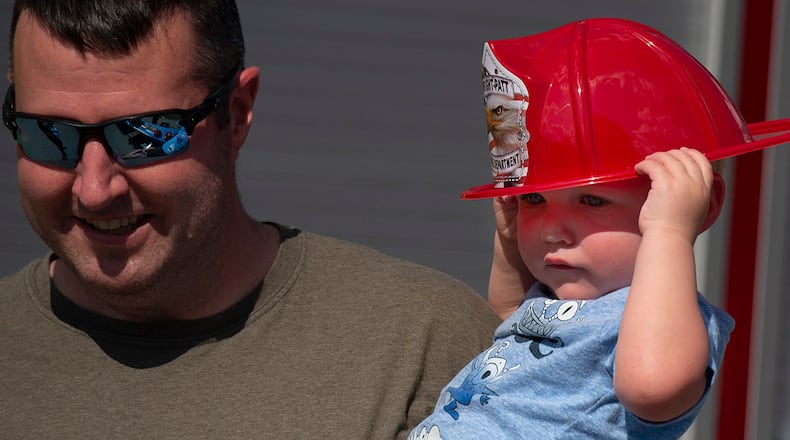 Andrew Hertzler, 2, and his dad, Jarrod, attend National Night Out at Wright-Patterson Air Force Base on Aug. 3. Andrew’s mother is Capt. Sonia Weiss, a nurse with the 88th Inpatient Operations Squadron. U.S. AIR FORCE PHOTO/R.J. ORIEZ