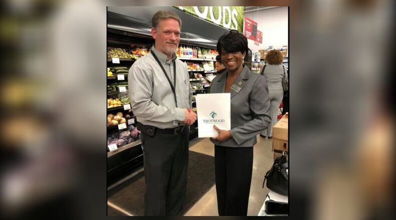 Trotwood Mayor Mary McDonald and a Gordon Food Service official shake on a new deal while in Detroit on Friday, Jan. 24, 2020. (Courtesy/Trotwood delegation)