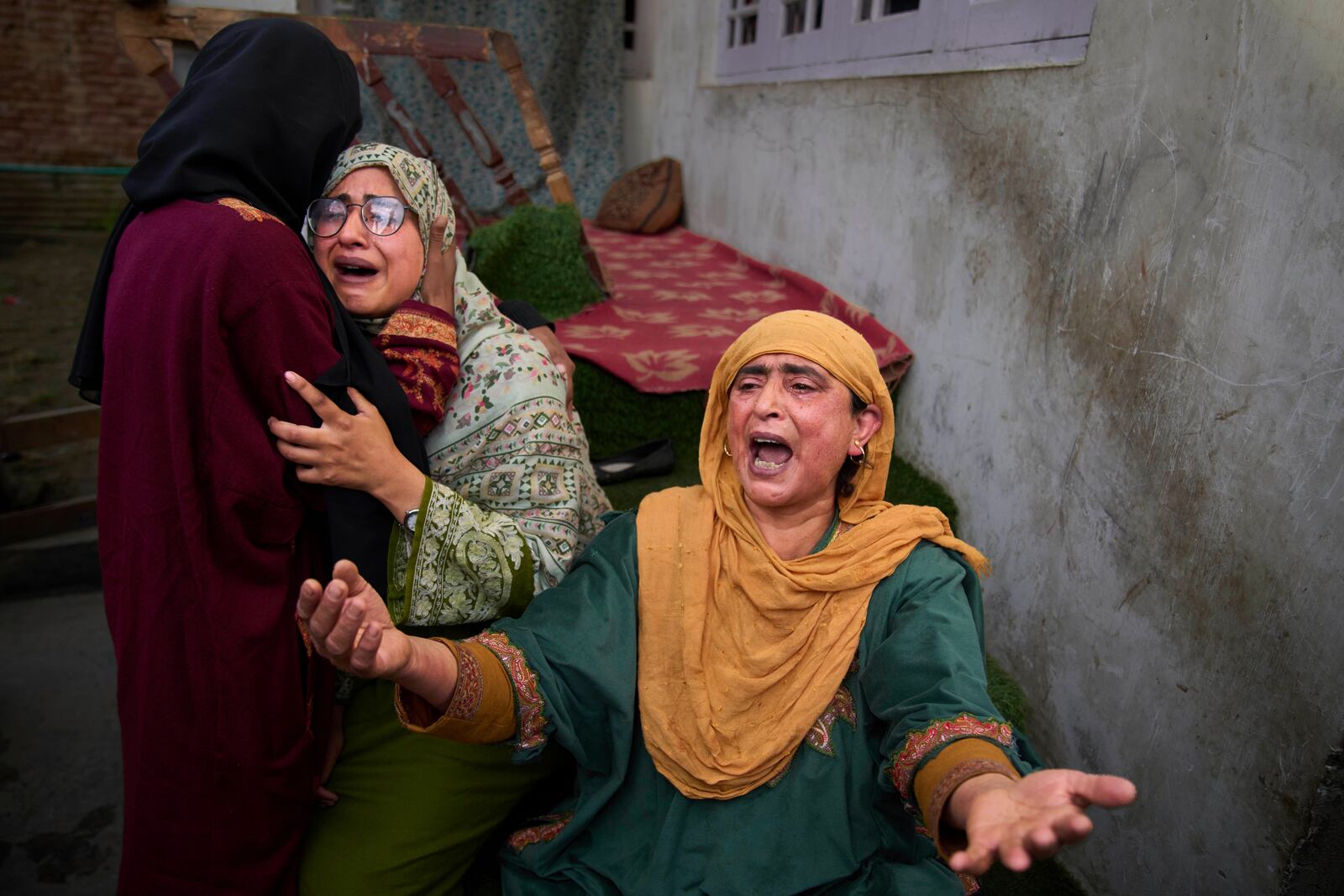 Relatives of Ahsan Ul Haq Shiekh, a militant who officials say is involved in the deadly attack on tourists in Pahalgam, wail after after Indian forces blew up the family home at Murran village in Pulwama, south of Srinagar, Indian controlled Kashmir, Saturday, April 26, 2025. (AP Photo/Dar Yasin)