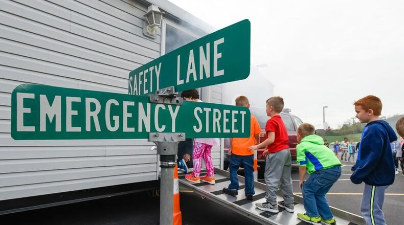 Hamilton firefighters gave a fire safety presentation to students at Brookwood Elementary in 2016. NICK GRAHAM/STAFF