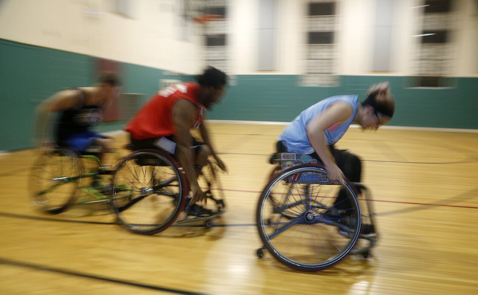 During a recent practice members of the Miami Valley Raptors wheelchair basketball team run drills. LISA POWELL / STAFF