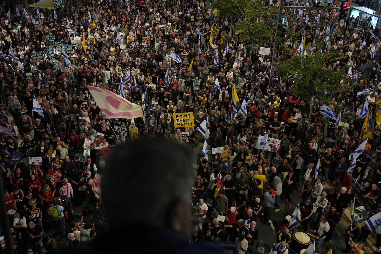 People take part in a protest demanding the immediate release of hostages held by Hamas in the Gaza Strip, in Tel Aviv, Israel, on Saturday, April 19, 2025. (AP Photo/Ariel Schalit)