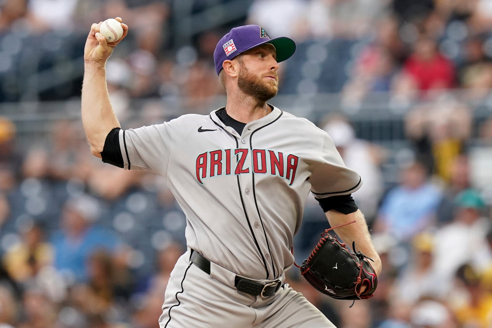 Arizona Diamondbacks pitcher Merrill Kelly delivers during the first inning of a baseball game against the Pittsburgh Pirates, Saturday, July 26, 2025, in Pittsburgh. (AP Photo/Matt Freed)