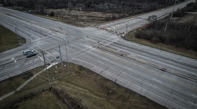 The intersection of Ohio 49 and East Main Street has reopened after repairs to the bridge over Dry Run were completed. JIM NOELKER/STAFF