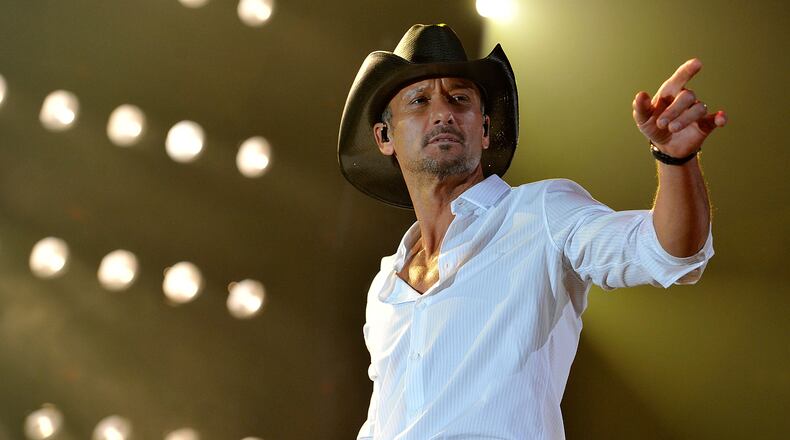 NASHVILLE, TN - APRIL 16: Tim McGraw performs during Keith Urban's Fourth annual We're All For The Hall benefit concert at Bridgestone Arena on April 16, 2013 in Nashville, Tennessee. (Photo by Frederick Breedon IV/Getty Images for the Country Music Hall of Fame and Museum)