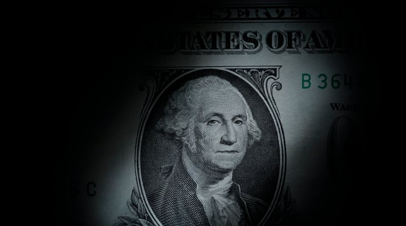 FILE - The likeness of George Washington is seen on a U.S. one dollar bill, March 13, 2023, in Marple Township, Pa. AP FILE