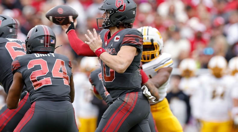 Oklahoma quarterback John Mateer (10) passes against Missouri during the first half of an NCAA college football game Saturday, Nov. 22, 2025, in Norman, Okla. (AP Photo/Alonzo Adams)