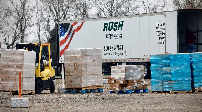 Volunteers are preparing for the annual Food Bank food distribution Thursday, Nov. 21, 2024 before Thanksgiving at the Dixie Twin drive-in theater at 6201 North Dixie Dr.
