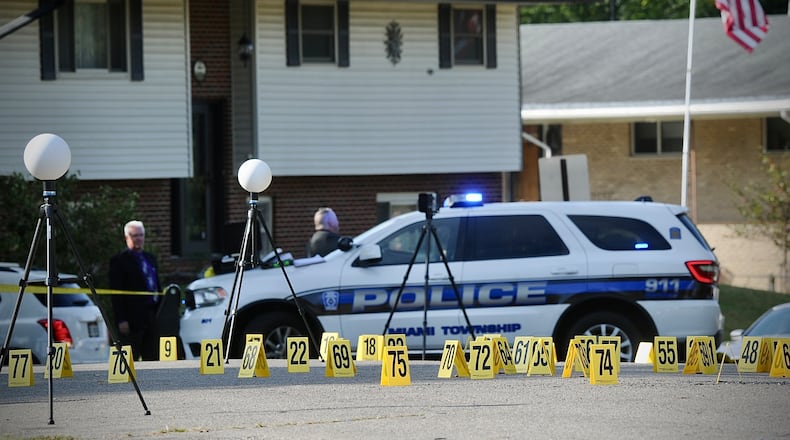 Evidence markers cover Verdi Drive in Miami Twp. after a multiple shots were fired Tuesday, Sept. 26, 2023. MARSHALL GORBY \STAFF