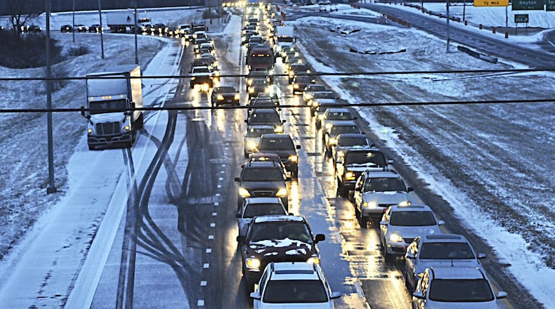 Drivers were at a standstill on Interstate 675 southbound near Interstate 70 Thursday after an early-morning snow burst caused whiteout conditions and slick highways across the region and contributed to three fatalities in the area. MARSHALL GORBY / STAFF