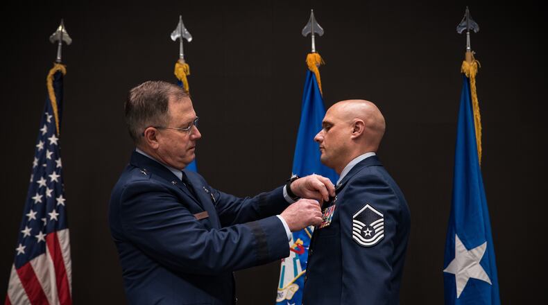 The Bronze Star was presented to Master Sgt. Timothy L. Heggedahl, an intelligence analyst, by Brig. Gen. James Dienst, commander of the Air Force Research Laboratory’s 711th Human Performance Wing, during a ceremony at the Air Force Institute of Technology, Wright-Patterson Air Force Base, on Feb. 26, 2020. (U.S. Air Force photo/Richard Eldridge)