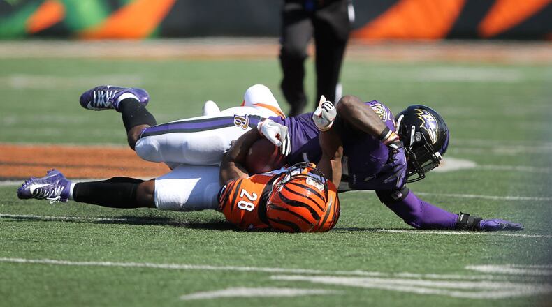 CINCINNATI, OH - SEPTEMBER 10: C.J. Mosley #57 of the Baltimore Ravens tackles Joe Mixon #28 of the Cincinnati Bengals during the fourth quarter at Paul Brown Stadium on September 10, 2017 in Cincinnati, Ohio. Baltimore defeated Cincinnati 20-0. (Photo by John Grieshop/Getty Images)