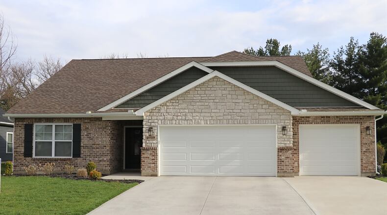 Less than 3 years old, this open concept ranch has a spacious common area, secluded main bedroom suite and flexible guest wing. The 3-bedroom home offers about 1,720 sq. ft. of living space and a 3-car garage. CONTRIBUTED PHOTO BY KATHY TYLER