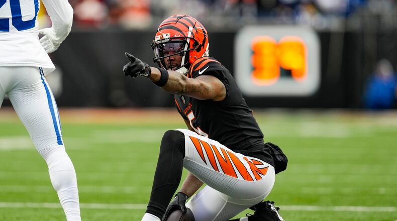 Cincinnati Bengals wide receiver Tee Higgins (5) signals for a first down after a catch against the Indianapolis Colts in the second half of an NFL football game in Cincinnati, Sunday, Dec. 10, 2023. (AP Photo/Carolyn Kaster)