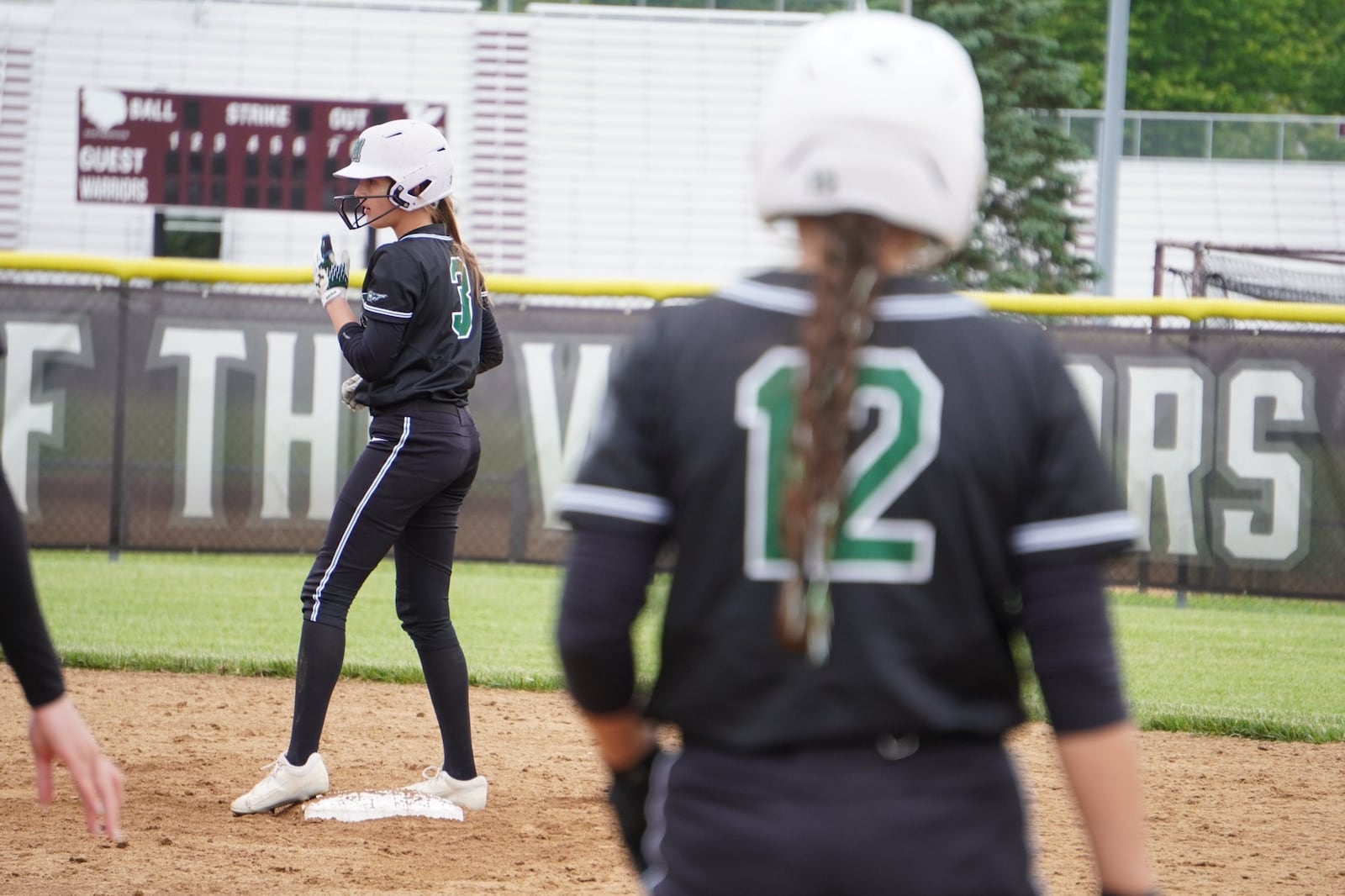 Mason's Brooke Henson (3) stands on second base while teammate Alea Hensley (12) stands on first during their Division I district final against Springboro on Thursday at Lebanon. CHRIS VOGT / CONTRIBUTED