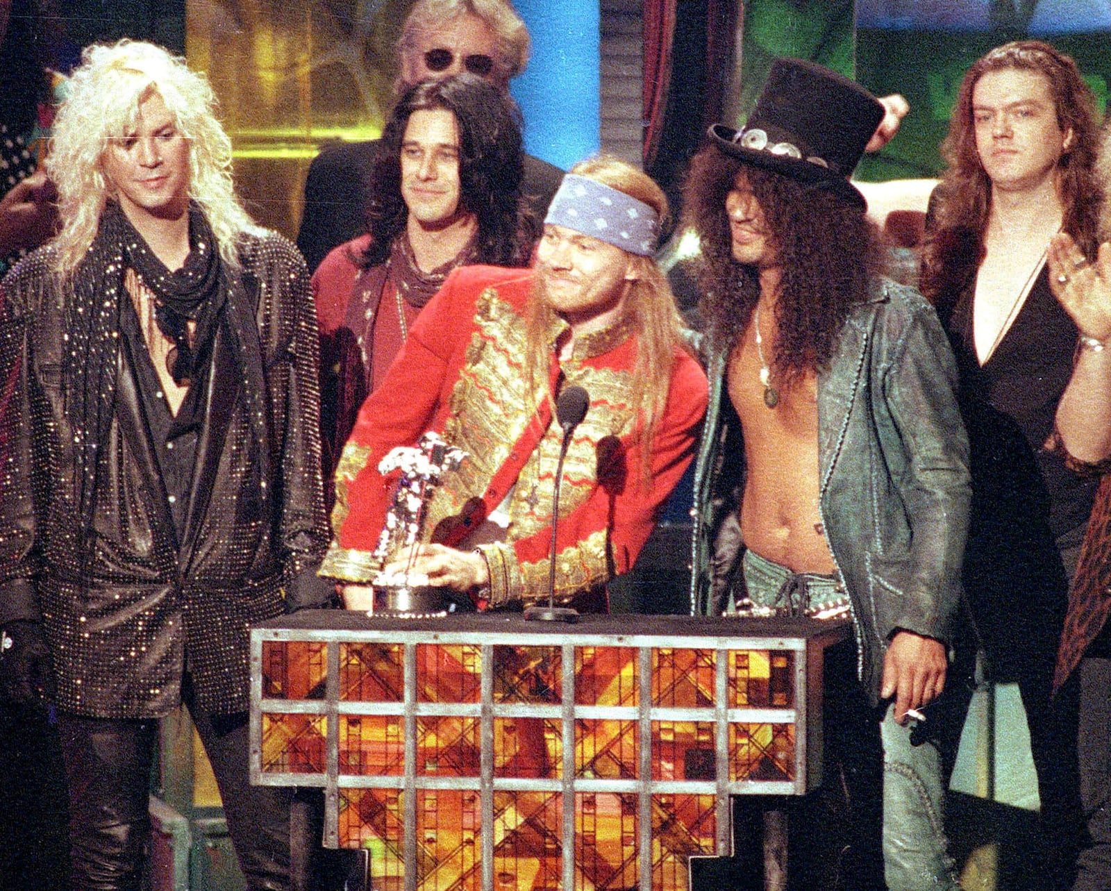 FILE - Guns N' Roses, from left, Michael "Duff" McKagan, Dizzy Reed, Axl Rose, Saul "Slash" Hudson and Matt Sorum, accept the Michael Jackson Video Vanguard Award at the MTV Video Music Awards in Los Angeles on Sept. 9, 1992. (AP Photo/Kevork Djansezian, File)