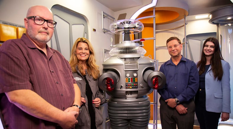 MeTV's "Collector's Call" will share the "Lost in Space" collection of New Carlisle resident Tom Pfrogner on Sunday
L to R: Expert Doug Hines, host Lisa Whelchel, collector Tom Pfrogner and his daughter Tracie Pfrogner. - Contributed