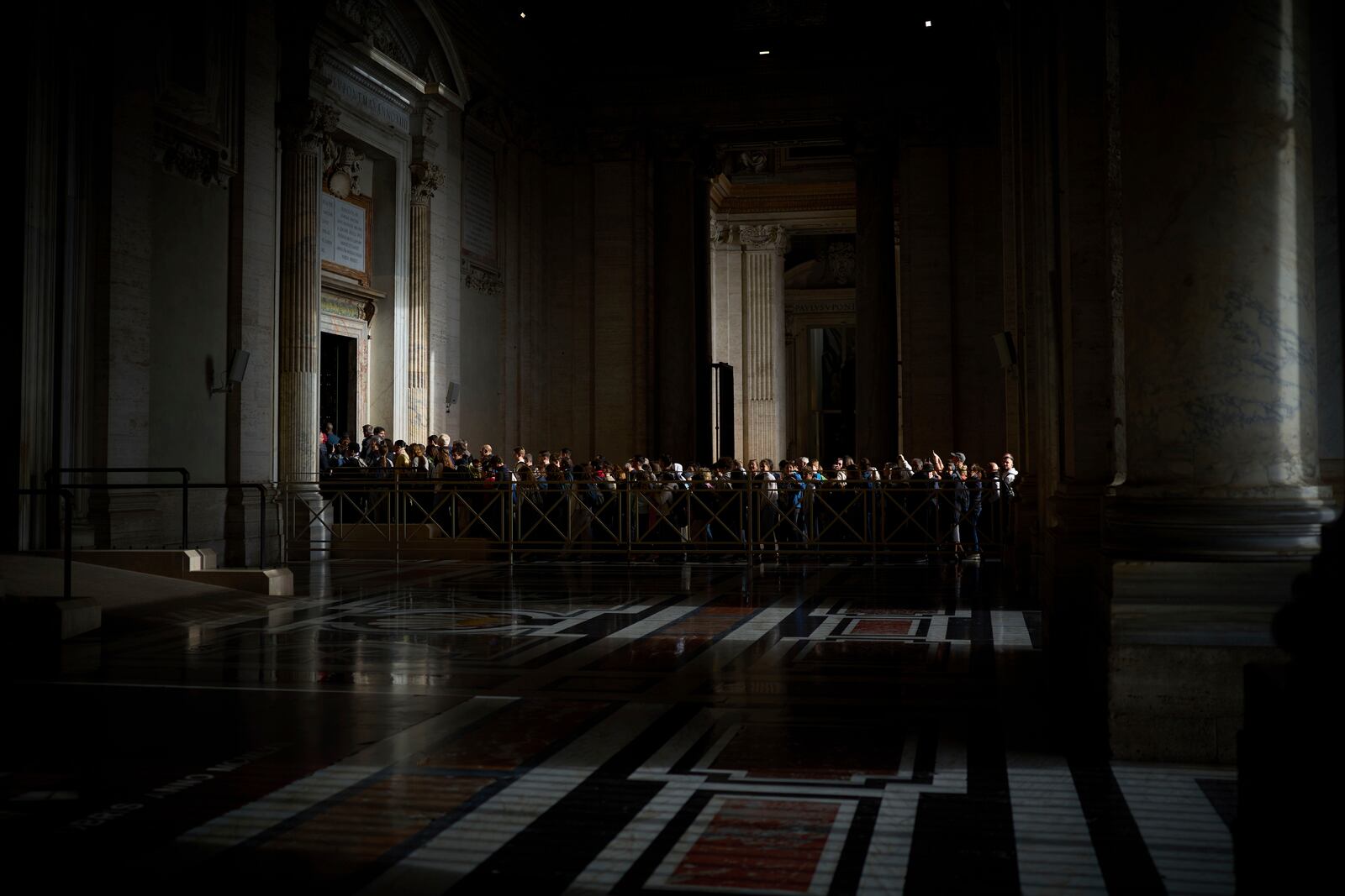 People line up as they enter St. Peter's Basilica to pay their respects to Pope Francis lying in state, at the Vatican, Thursday, April 24, 2025. (AP Photo/Emilio Morenatti)