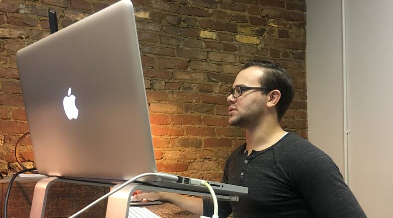 Many millennials are rebuking the typical work setting. Nucleus CoShare, a popular co-working share space in the Oregon District, is an alternative environment for younger workers. KARA DRISCOLL/STAFF