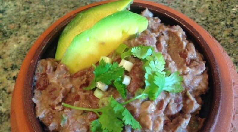 On nachos or on their own, homemade refried beans taste better and are healthier than the canned versions. (Ellen Kanner/Miami Herald/TNS)