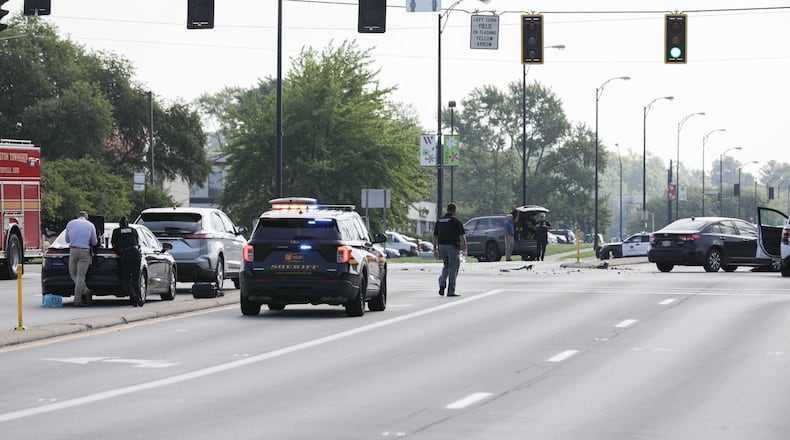 A stolen vehicle connected to a home invasion in Kentucky fled from Springboro police, resulting in a chase and crash at Ohio 725 and Paragon Road in Washington Twp. on Monday, Aug. 11, 2025. A female was taken into custody at the scene and a man was arrested on Paragon Road following a large police presence and shelter in place advisory. BRYANT BILLING / STAFF