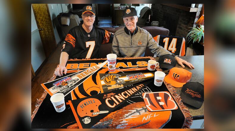 John Kavanaugh, left and his brother Tom, are lifelong Bengal fans, they are traveling to California to watch the Bengals take on the Rams. MARSHALL GORBY\STAFF