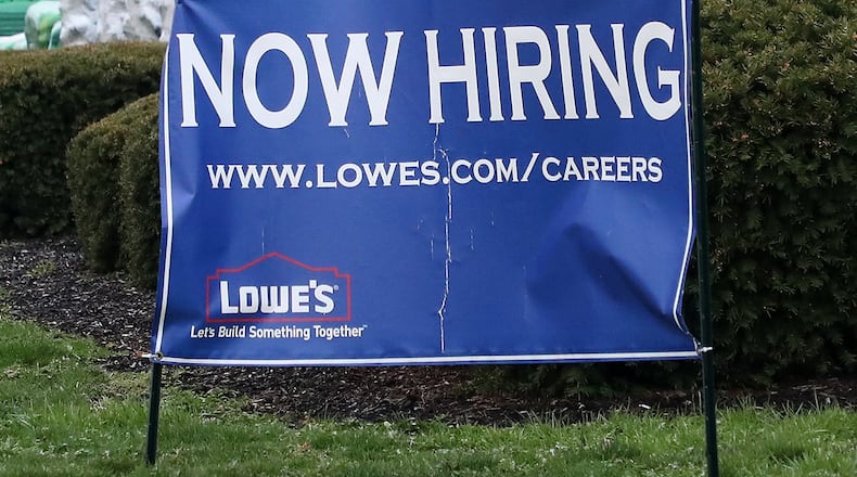 Lowe’s in Springfield has a Now Hiring sign along Bechtle Avenue. BILL LACKEY/STAFF