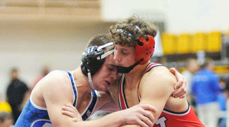 Cameron Carnevale of Miamisburg (left) and Austin Mullins of Wayne were matched in the opening day of the GMVWA Holiday wrestling tournament at Butler last month. The Miamisburg Invitational scheduled for Saturday, Jan., 12, has been canceled. MARC PENDLETON / STAFF