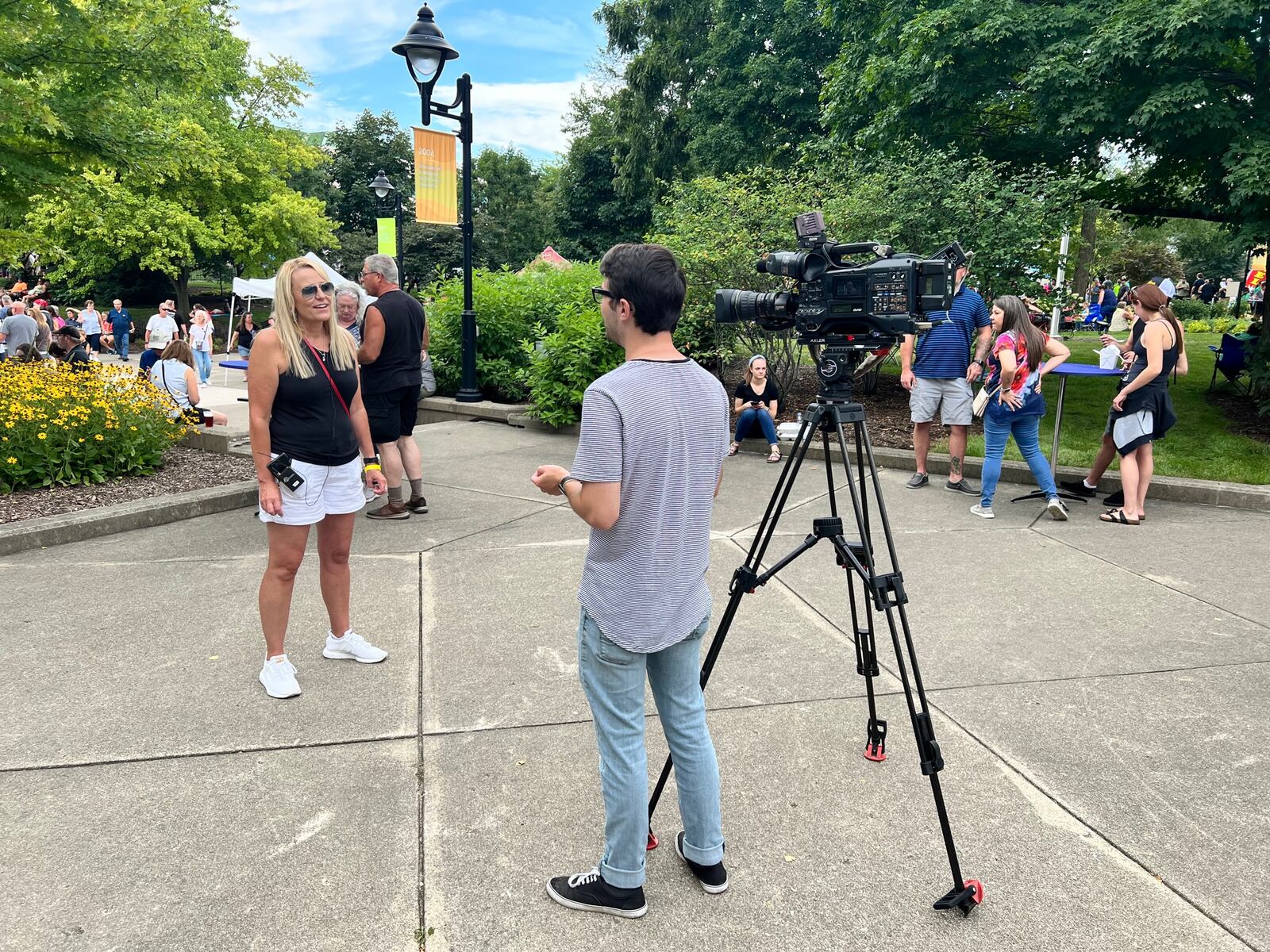 Amy Zahora, Zahora, president of the Miami Valley Restaurant Association, speaking to a news crew at Bacon Fest 2022. She got the idea for Bacon Fest after noticing how much her nephews loved bacon. ALEXIS LARSEN/CONTRIBUTOR