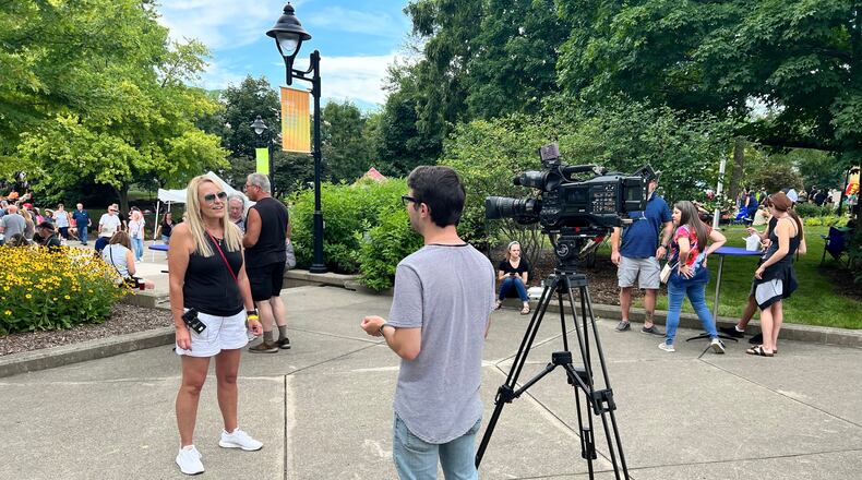 Amy Zahora speaking to a news crew at Bacon Fest 2022. ALEXIS LARSEN/CONTRIBUTED