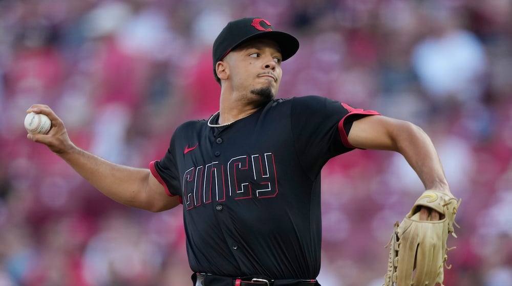 Cincinnati Reds pitcher Chase Burns throws during the first inning of a baseball game against the Colorado Rockies in Cincinnati, Friday, July 11, 2025. (AP Photo/Carolyn Kaster)
