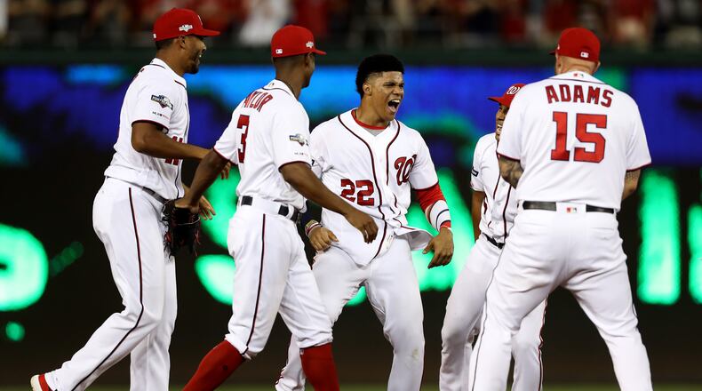 WASHINGTON, DC - OCTOBER 01: Juan Soto #22 of the Washington Nationals celebrates after defeating the Nationals defeated the Milwaukee Brewers 4 to 3 in the National League Wild Card game at Nationals Park on October 01, 2019 in Washington, DC. (Photo by Rob Carr/Getty Images)