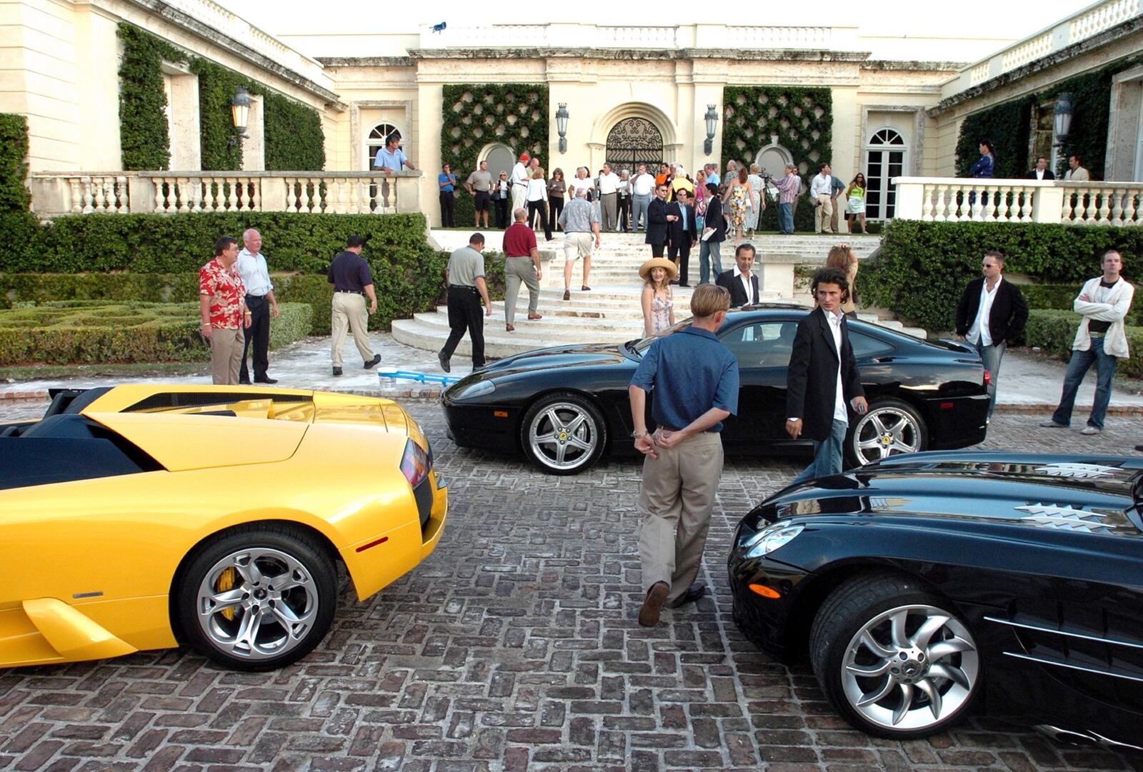 A Lamborghini Murcielago, Ferrari 550 Maranello and a Mecerdes-Benz SLR McLaren dress up the driveway during an open house that was part of the marketing of Donald Trump’s mansion in Palm Beach. (Jeffrey Langlois / Palm Beach Daily News)