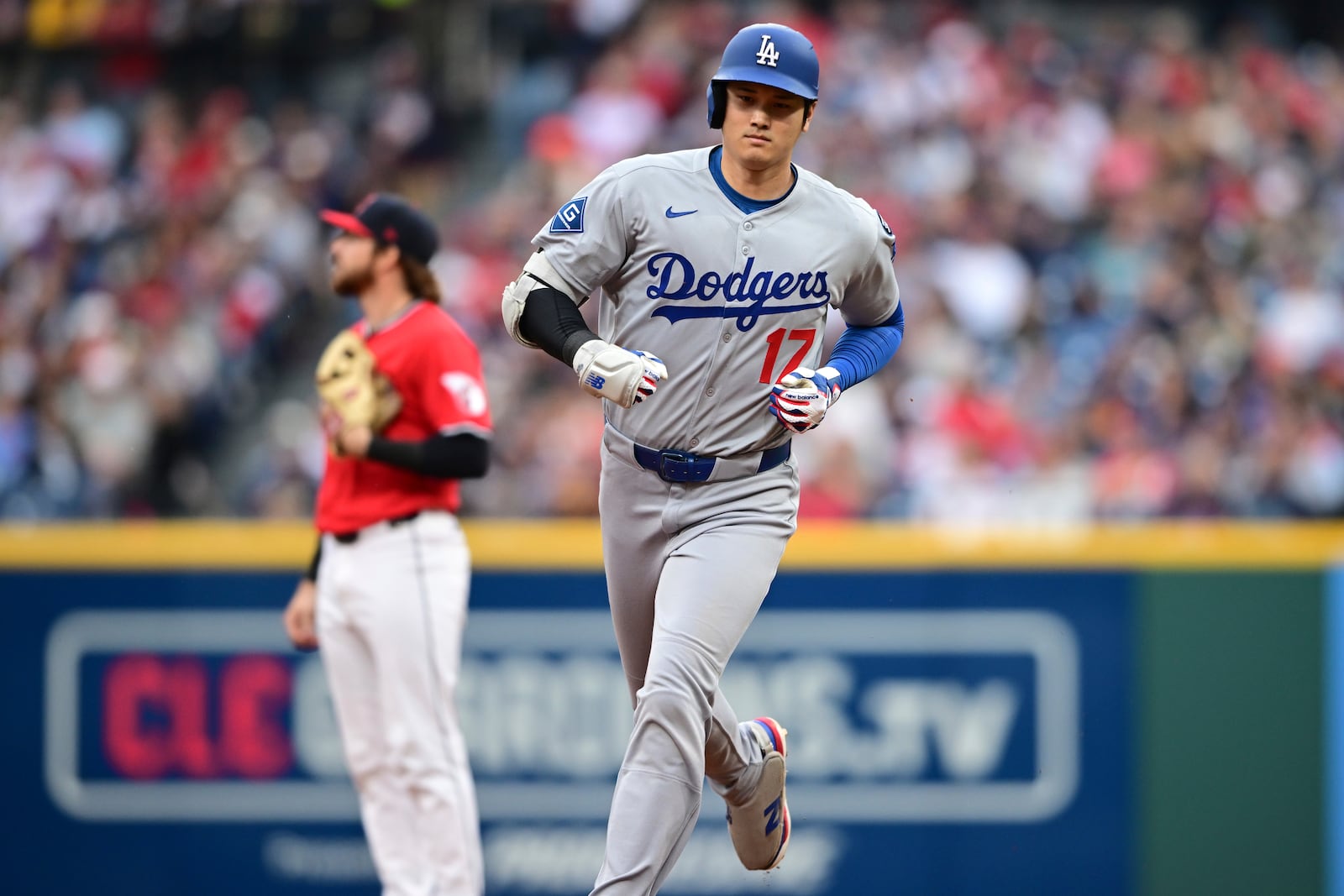 Los Angeles Dodgers' Shohei Ohtani runs the bases after hitting a two run home run off Cleveland Guardians starting pitcher Tanner Bibee during the fourth inning of a baseball game, Tuesday, May 27, 2025, in Cleveland. (AP Photo/David Dermer)
