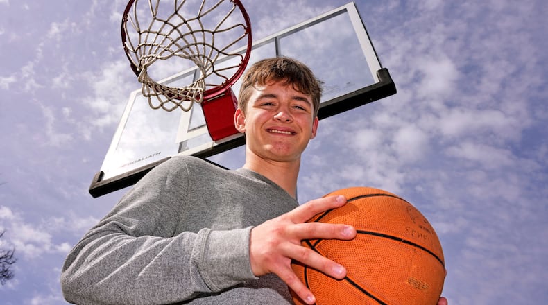 Otto Schellhamer, an eighth-grader who has the only perfect bracket after the opening weekend of the men’s and women’s NCAA college basketball tournaments, poses in his backyard in Plum Borough, Pa., Wednesday, March 25, 2026. (AP Photo/Gene J. Puskar)