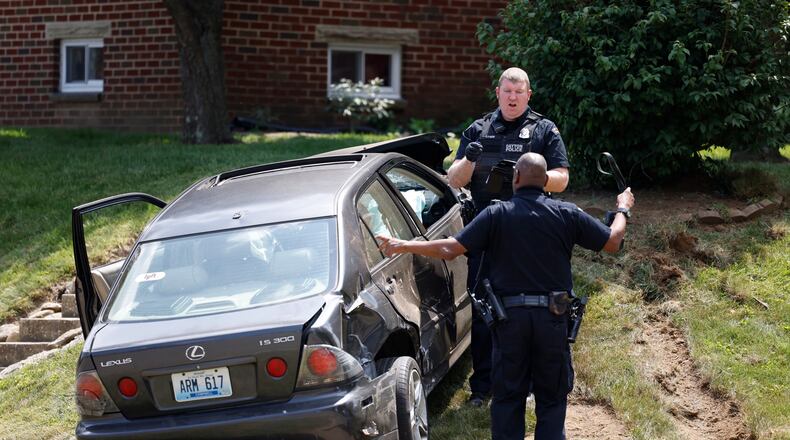 The driver of a gray Lexus fled a traffic stop and then intentionally rammed a Dayton officer's cruiser, which led to a police pursuit  in east Dayton that ended in a crash at the intersection of Murray Drive and East Fourth Street when the suspect car collided with a silver car that struck a U.S. Postal Service van.. The suspect ran but was caught by officers a couple blocks away and is in custody. Jim Noelker/Staff