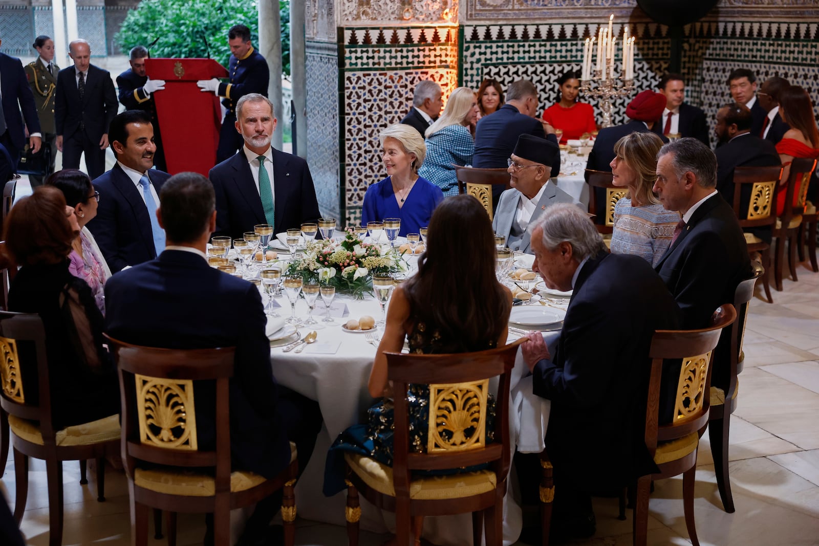 Spain's King Felipe VI, top 2nd left, sits with Qatar's Emir Sheikh Tamim bin Hamad Al Thani, top left, European Commission President Ursula von der Leyen, top 3rd left, Nepal Prime Minister Khadga Prasad Oli, top, 4th left and Antonio Guterres, Secretary-General of the United Nations, lower right, during a gala dinner on the eve of the U.N. financing for development conference in Seville, Spain, Sunday, June 29, 2025. (Chema Moya/Pool Photo via AP)