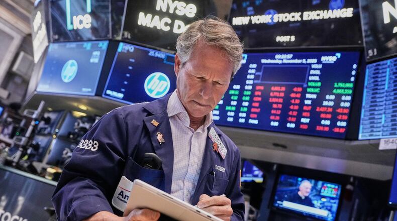 Trader Robert Charmak works on the floor of the New York Stock Exchange, Wednesday, Nov. 5, 2025. (AP Photo/Richard Drew)