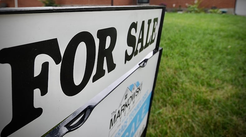 A house for sale on Valleywood Drive In Kettering. Home sales in the Dayton region continue to decline in a year-over-year basis, but the price at which they are sold continues to rise, according to statistics released Thursday, June 22, 2023 by Dayton Realtors. MARSHALL GORBY \STAFF