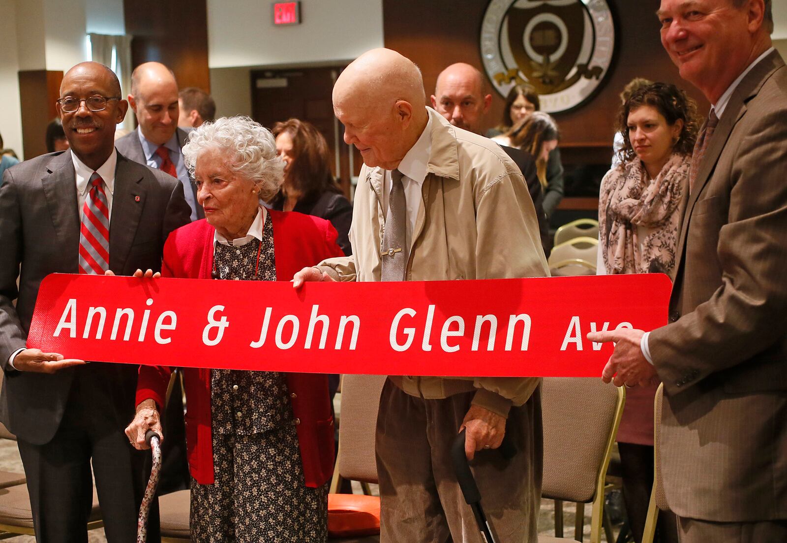 The Ohio State University President Michael V. Drake, Annie Glenn, former U.S. Senator John Glenn and chairman of the OSU Board of Trustees Jeffrey Wadsworth. (Columbus Dispatch photo by Brooke LaValley)