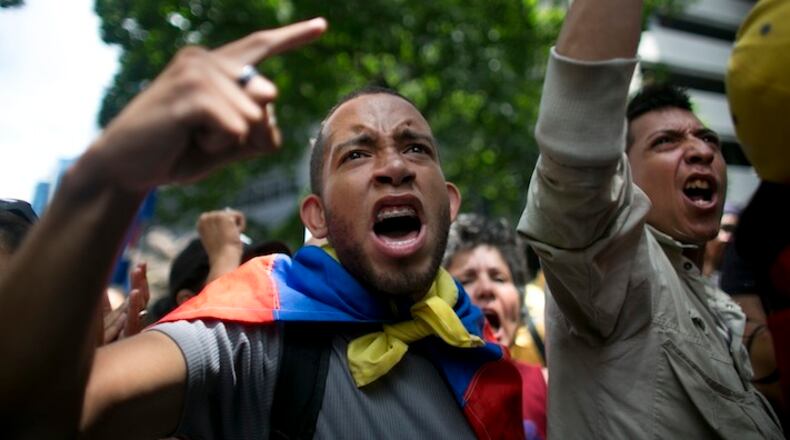 Opposition protesters shout out "Maduro" during a demonstration demanding the government pursue a referendum to recall President Nicolas Maduro, in Caracas, Venezuela, Wednesday, May 25, 2016. (AP Photo/Ariana Cubillos)