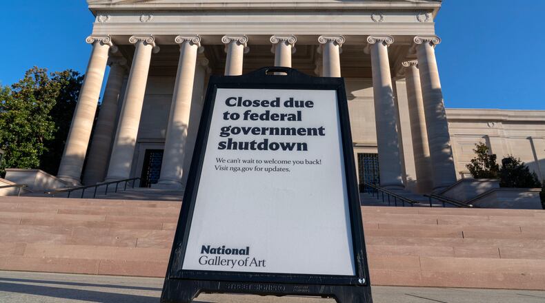 FILE - A sign that reads "Closed due to federal government shutdown," is seen outside of the National Gallery of Art in Washington, Oct. 6, 2025. (AP Photo/Jose Luis Magana, File)