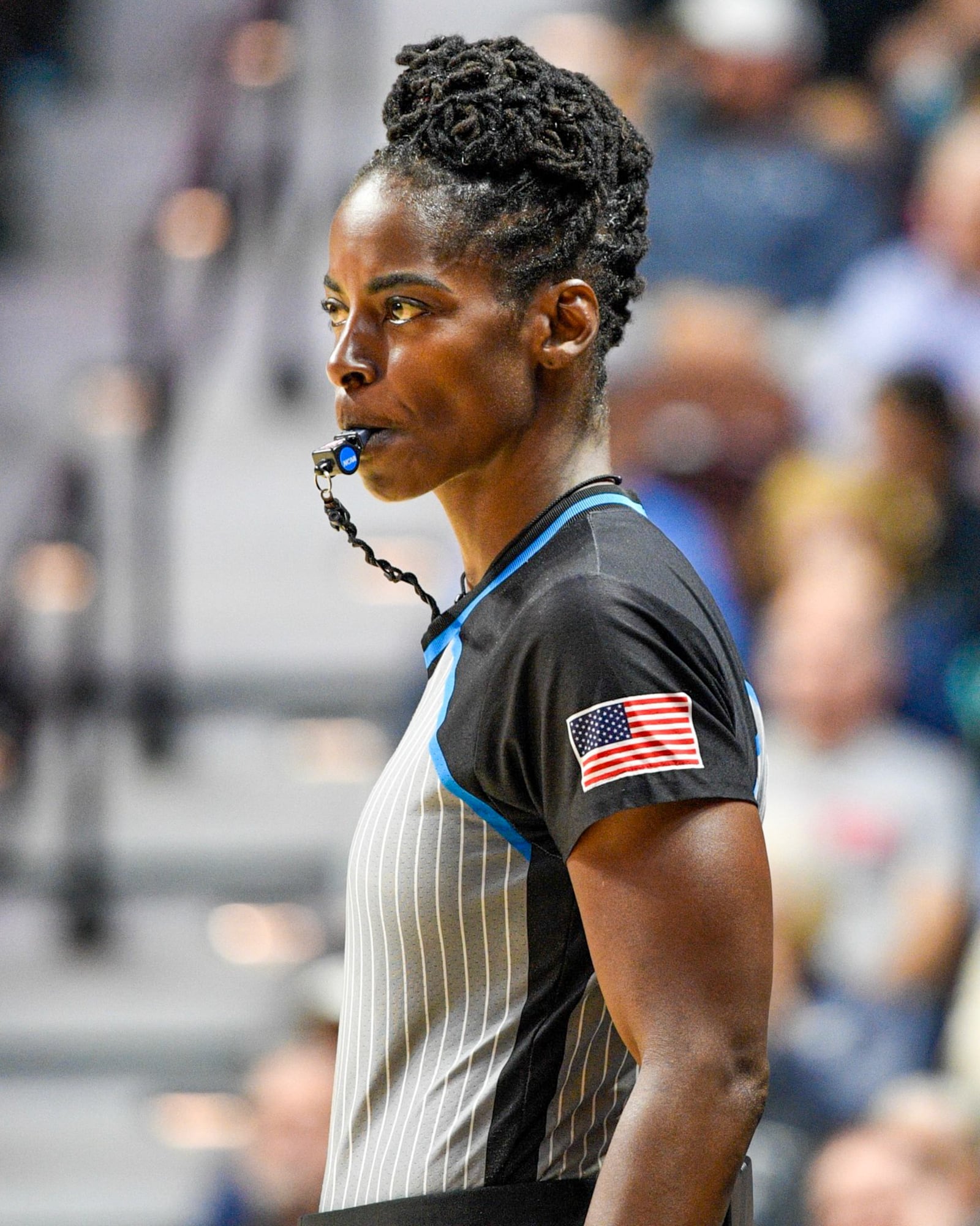 College basketball official Linda Miles, a Cincinnati native and former WWE Superstar, officiates a recent game. CONTRIBUTED PHOTO