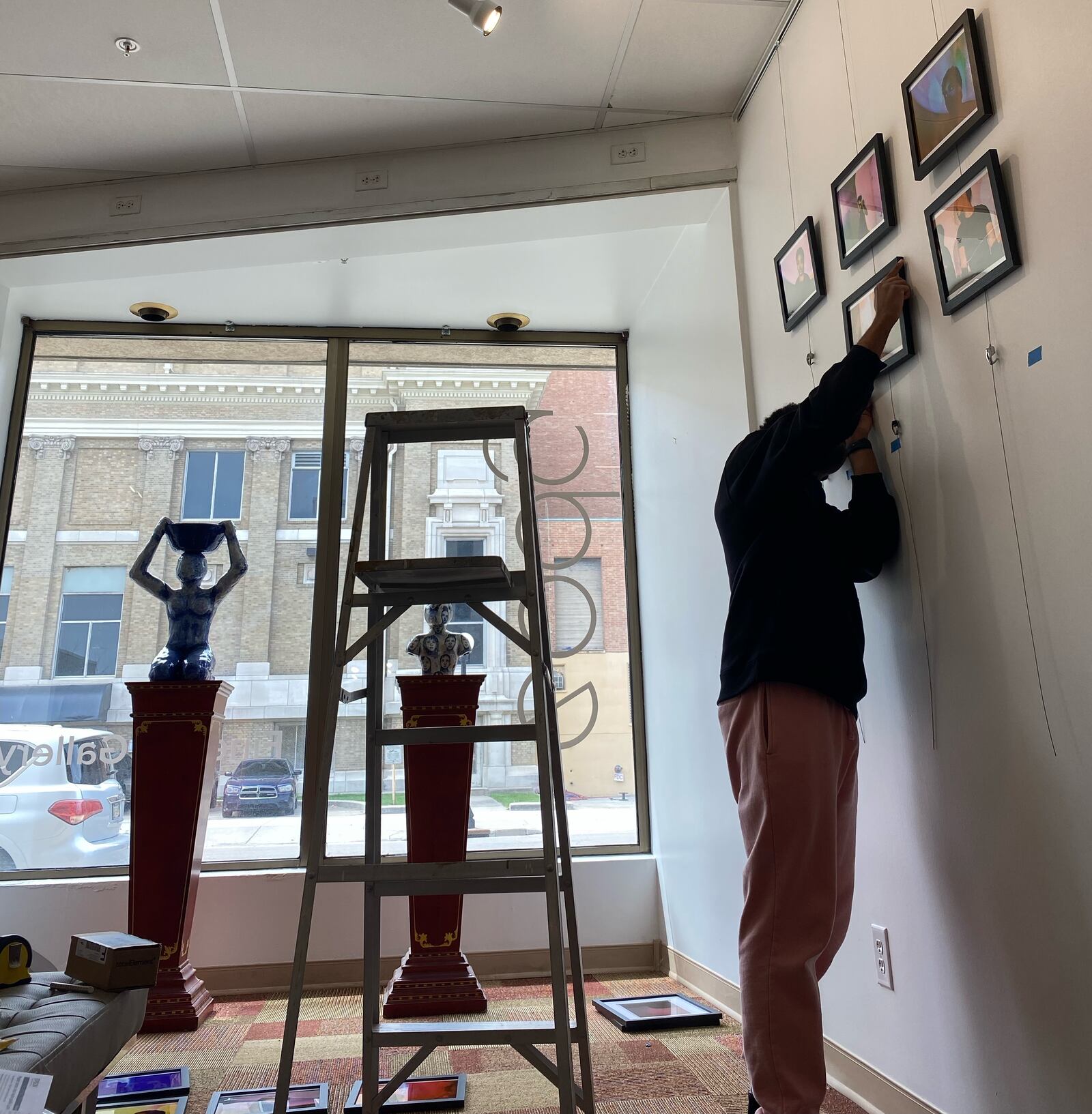 UD student artist CJ Wilson installing his work at the Edward A. Dixon Gallery for the "Visions" exhibition, which runs from Friday, April 7 through Tuesday, April 25. CONTRIBUTED