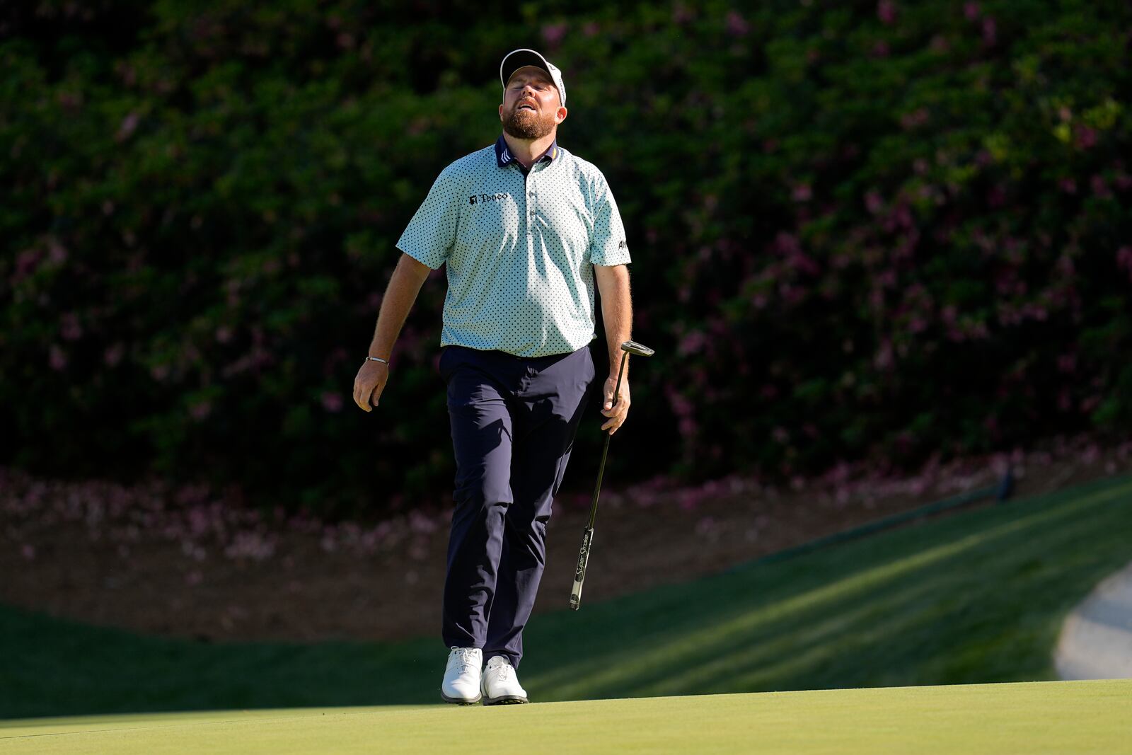 Shane Lowry, of Ireland, reacts after missing a putt on the 13th hole during the third round at the Masters golf tournament, Saturday, April 12, 2025, in Augusta, Ga. (AP Photo/David J. Phillip)