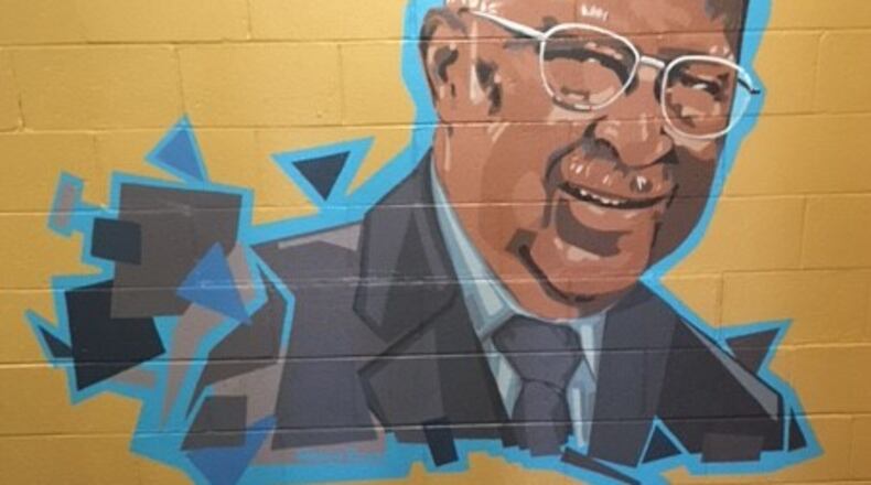 This mural of John E. Moore, by Xenia artist Maggie Reckers, is painted on a wall at Mckinley United Methodist Church (Photo taken by Ray Marcano)